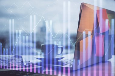 Kişisel bilgisayar arkaplanına çizilmiş borsa hologramı. Çifte maruziyet. Yatırım kavramı.