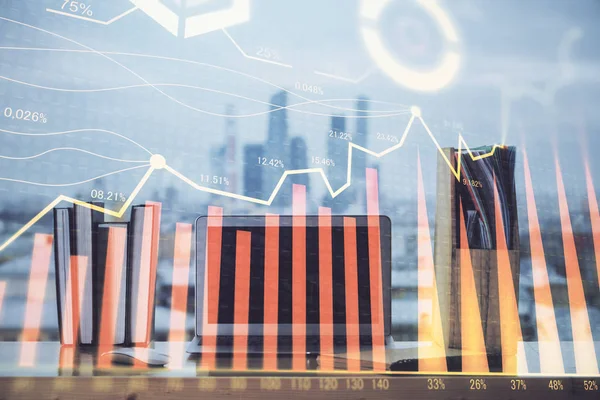 Stock market graph on background with desk and personal computer. Multi exposure. Concept of financial analysis.