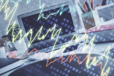 Finansal pazar grafiği hologramı ve kişisel bilgisayar arka planda. Çifte maruziyet. Önx kavramı.