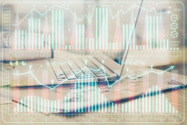 Finansal grafik renkli çizimler ve arka planda bilgisayar olan tablolar. Çifte maruziyet. Uluslararası pazarlar kavramı.
