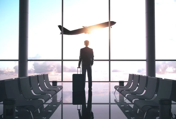 Businessman standing in airport — Stock Photo, Image