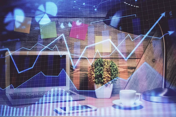 Double exposure of graph and financial info and work space with computer background. Concept of international online trading.