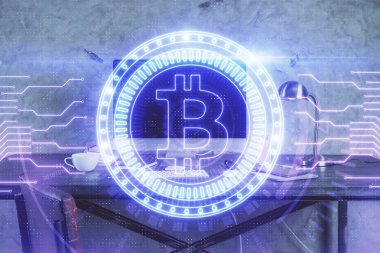 Engelleme zinciri ve kripto ekonomi temalı hologram ve bilgisayar geçmişi olan bir masa. Bitcoin kripto para kavramı.