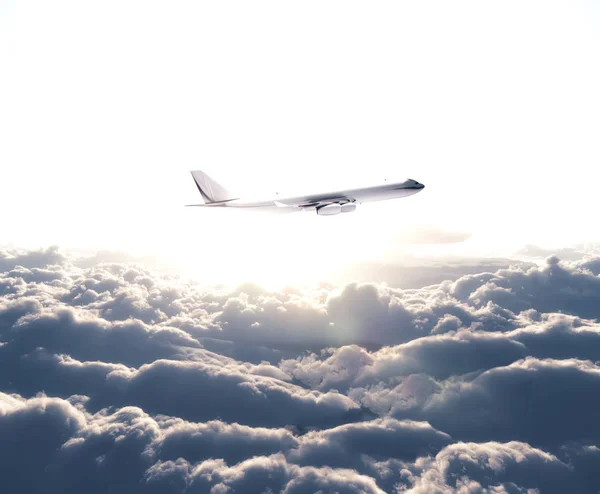 Airplane flying over the white clouds — Stock Photo, Image
