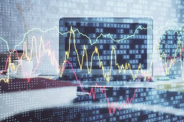 Finansal tablo çizimi ve arka planda bilgisayar olan bir tablo. Çifte maruziyet. Uluslararası pazarlar kavramı.