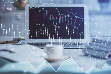 Finansal grafik renkli çizimler ve arka planda bilgisayar olan tablolar. Çifte maruziyet. Uluslararası pazarlar kavramı.