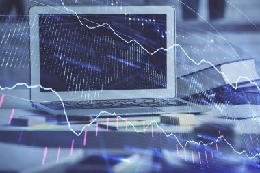 Finansal tablo çizimi ve arka planda bilgisayar olan bir tablo. Çoklu maruz kalma. Uluslararası pazarlar kavramı.