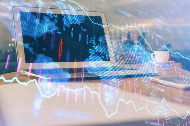 Finansal pazar grafiği hologramı ve kişisel bilgisayar arka planda. Çifte maruziyet. Önx kavramı.