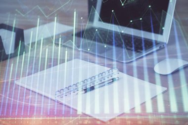 Finansal grafik renkli çizimler ve arka planda bilgisayar olan tablolar. Çifte maruziyet. Uluslararası pazarlar kavramı.