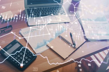 Grafik ve finansal bilgilere çifte maruz kalma ve bilgisayar geçmişi olan çalışma alanı. Uluslararası çevrimiçi ticaret kavramı.