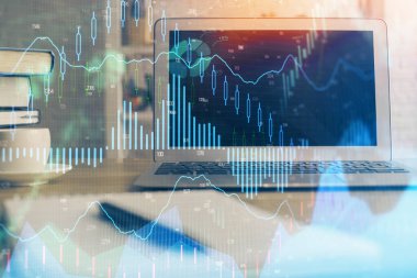 Finansal tablo çizimi ve arka planda bilgisayar olan bir tablo. Çoklu maruz kalma. Uluslararası pazarlar kavramı.