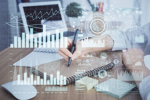 Financial charts displayed on womans hand taking notes background. Concept of research. Double exposure — Stock Photo, Image