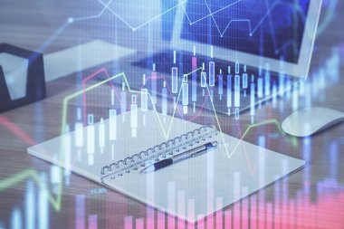 Finansal grafik renkli çizimler ve arka planda bilgisayar olan tablolar. Çifte maruziyet. Uluslararası pazarlar kavramı.