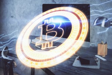 Engelleme zinciri ve kripto ekonomi temalı hologram ve bilgisayar geçmişi olan bir masa. Bitcoin kripto para kavramı.