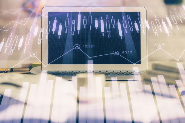 Financial market graph hologram and personal computer on background. Double exposure. Concept of forex.