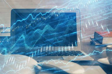 Finansal tablo çizimi ve arka planda bilgisayar olan bir tablo. Çoklu maruz kalma. Uluslararası pazarlar kavramı.