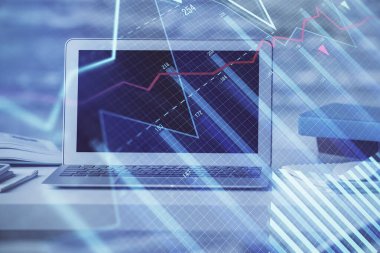 Finansal tablo çizimi ve arka planda bilgisayar olan bir tablo. Çoklu maruz kalma. Uluslararası pazarlar kavramı.