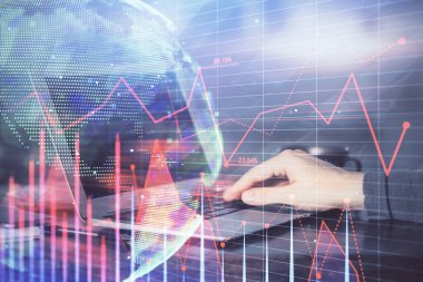 Forex grafik arka plan ile borsa dizüstü bilgisayar ile notlar yazma mans elçift pozlama. Üst Görünüm. Araştırma ve ticaret kavramı.