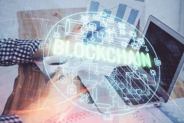 Crypto currency theme hologram with businessman working on computer on background. Concept of blockchain. Double exposure. — Stock Photo, Image