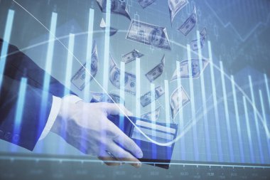 Finansal grafiğe çoklu pozlama hologram, Amerikan dolarları ve insan eli. Analiz kavramı.