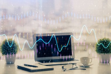 Finansal pazar grafiği hologramı ve kişisel bilgisayar arka planda. Çifte maruziyet. Önx kavramı.
