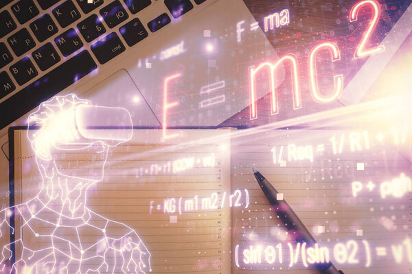 Physics and math theme hologram with formula drawings over computer on the desktop background. Top view. Multi exposure. Concept of education.