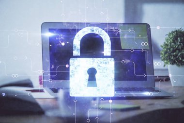 Bilgisayar ve ikon hologramı ile masaüstüne çift pozlama. Veri güvenliği kavramı.