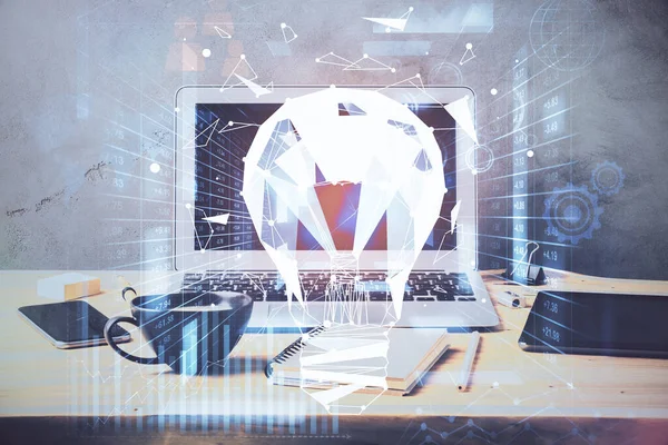 Computer on desktop in office with bulb icon hologram. Multi exposure. Concept of idea. — Stock Photo, Image