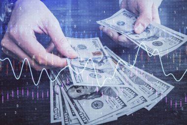 Finansal grafiğe çoklu pozlama hologram, Amerikan dolarları ve insan eli. Analiz kavramı.