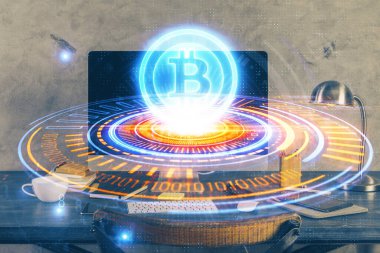 Engelleme zinciri ve kripto ekonomi temalı hologram ve bilgisayar geçmişi olan bir masa. Bitcoin kripto para kavramı.