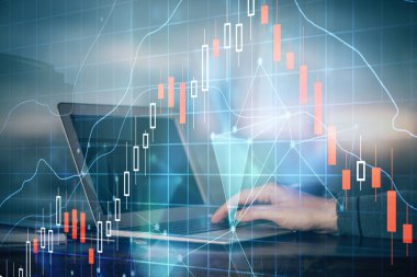 Arka planda dizüstü bilgisayar üzerinde çalışan adam ile borsa grafiği çift pozlama. Finansal analiz kavramı.