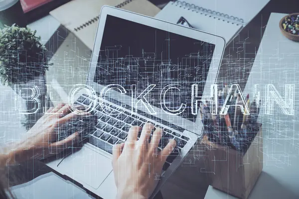 Crypto currency theme hologram with businessman working on computer on background. Concept of blockchain. Double exposure. — Stock Photo, Image