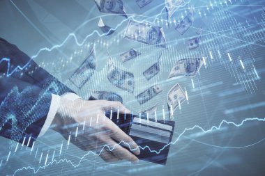 Finansal grafiğe çoklu pozlama hologram, Amerikan dolarları ve insan eli. Analiz kavramı.