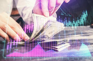 Forx grafiği, hologram, Amerikan dolarları ve insan eli çizimleri. Teknik Analiz kavramı.
