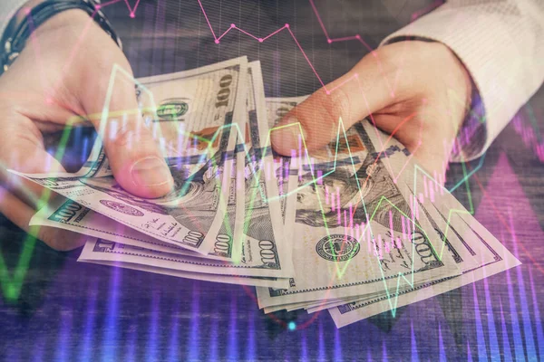 Multi blootstelling van de financiële grafiek tekenen hologram en Amerikaanse dollars rekeningen en man handen. Analyse concept. — Stockfoto