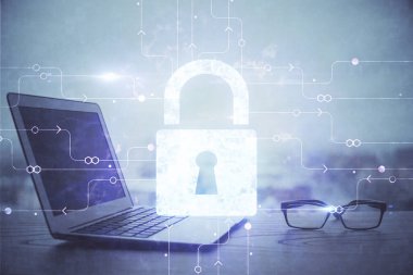 Bilgisayar ve ikon hologramı ile masaüstüne çift pozlama. Veri güvenliği kavramı.