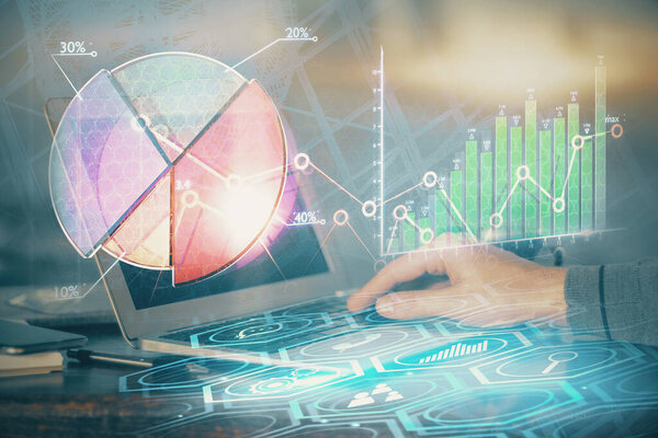 Multi exposure of stock market graph with man working on laptop on background. Concept of financial analysis.