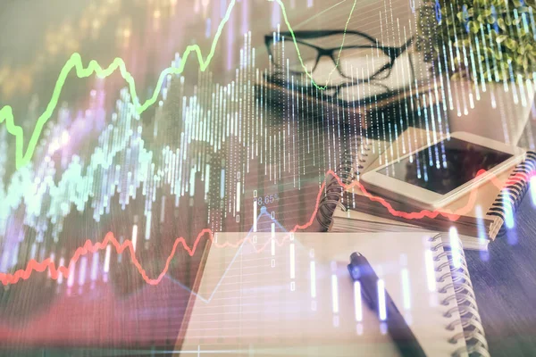 Double exposure of forex chart drawing and cell phone background. Concept of financial trading