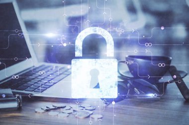 Bilgisayar ve ikon hologramı ile masaüstüne çift pozlama. Veri güvenliği kavramı.