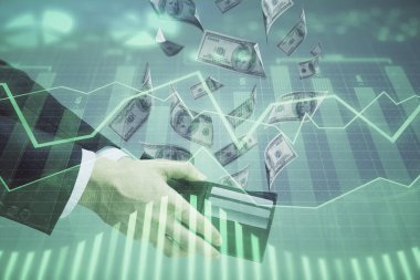Finansal grafiğe çoklu pozlama hologram, Amerikan dolarları ve insan eli. Analiz kavramı.