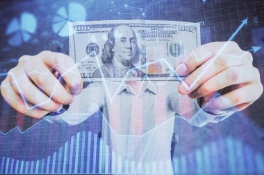 Finansal grafiğe çoklu pozlama hologram, Amerikan dolarları ve insan eli. Analiz kavramı.