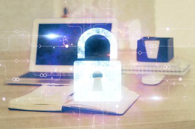 Bilgisayar ve ikon hologramı ile masaüstüne çift pozlama. Veri güvenliği kavramı.