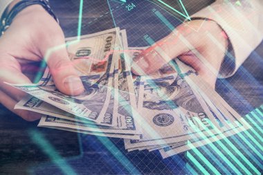 Finansal grafiğe çoklu pozlama hologram, Amerikan dolarları ve insan eli. Analiz kavramı.