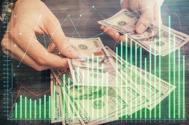 Finansal grafiğe çoklu pozlama hologram, Amerikan dolarları ve insan eli. Analiz kavramı.
