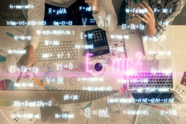 Double exposure of man and woman working together and formula hologram drawing. Computer background. Top View. Education concept. — Stock Photo, Image