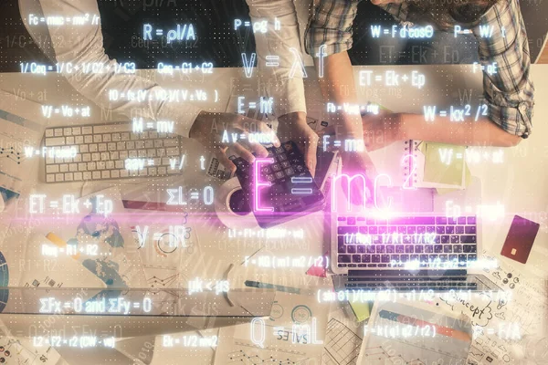 Double exposure of man and woman working together and formula hologram drawing. Computer background. Top View. Education concept. — Stock Photo, Image