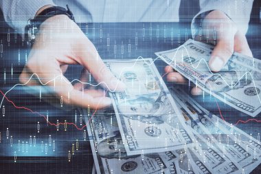 Finansal grafiğe çoklu pozlama hologram, Amerikan dolarları ve insan eli. Analiz kavramı.