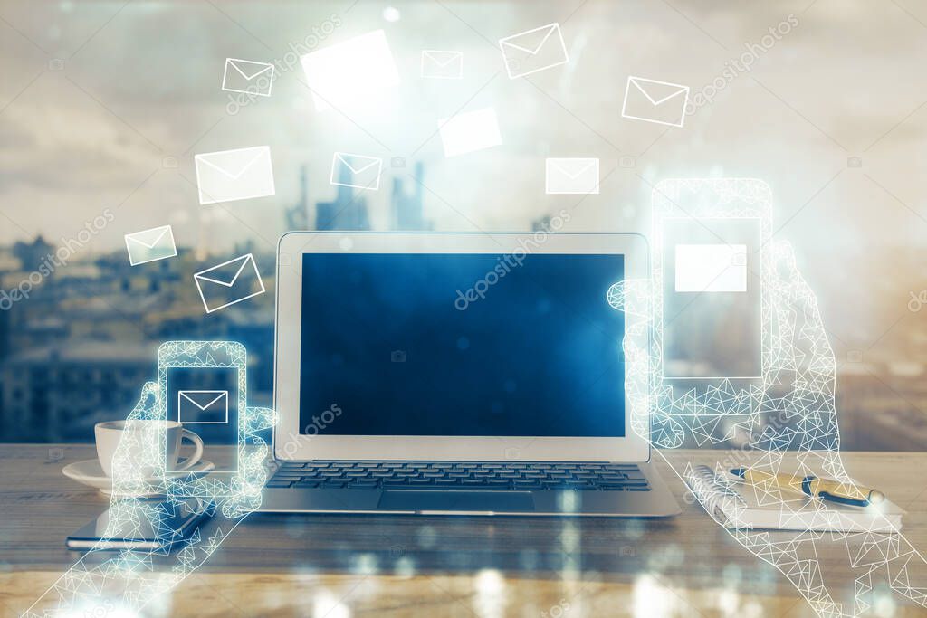 Desktop computer background in office and flying envelops hologram drawing. Multi exposure. Electronic mail concept.