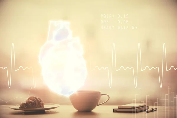 Double exposition de coeur dessin hologramme sur fond de tasse de café dans le bureau. Concept éducation médicale. — Photo