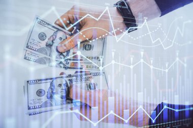 Finansal grafiğe çoklu pozlama hologram, Amerikan dolarları ve insan eli. Analiz kavramı.